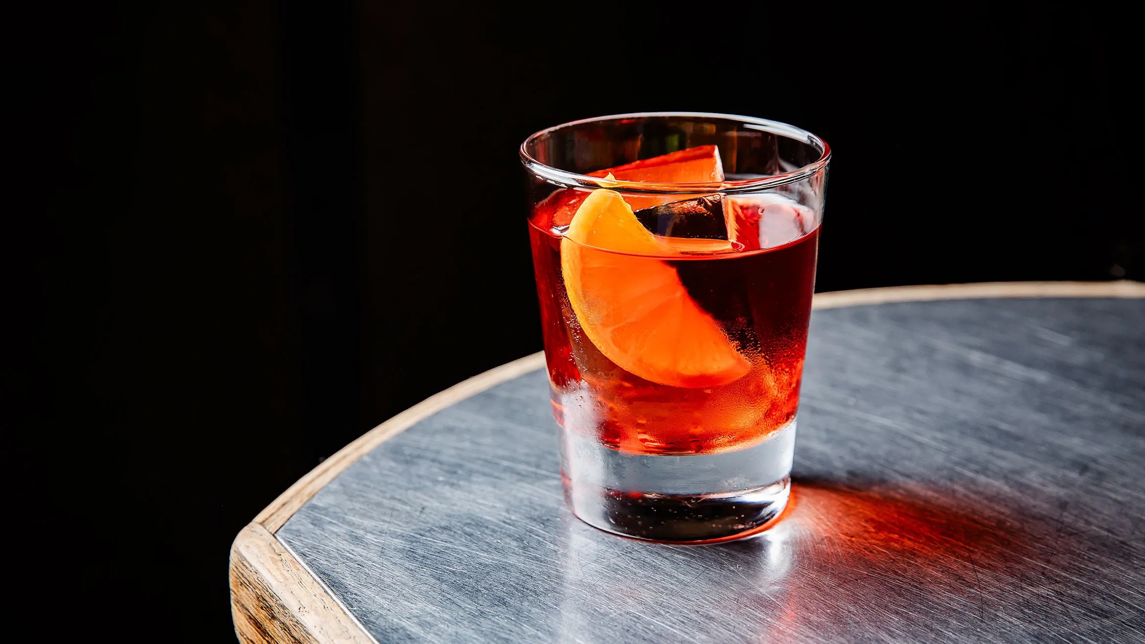 A negroni cocktail on a table.